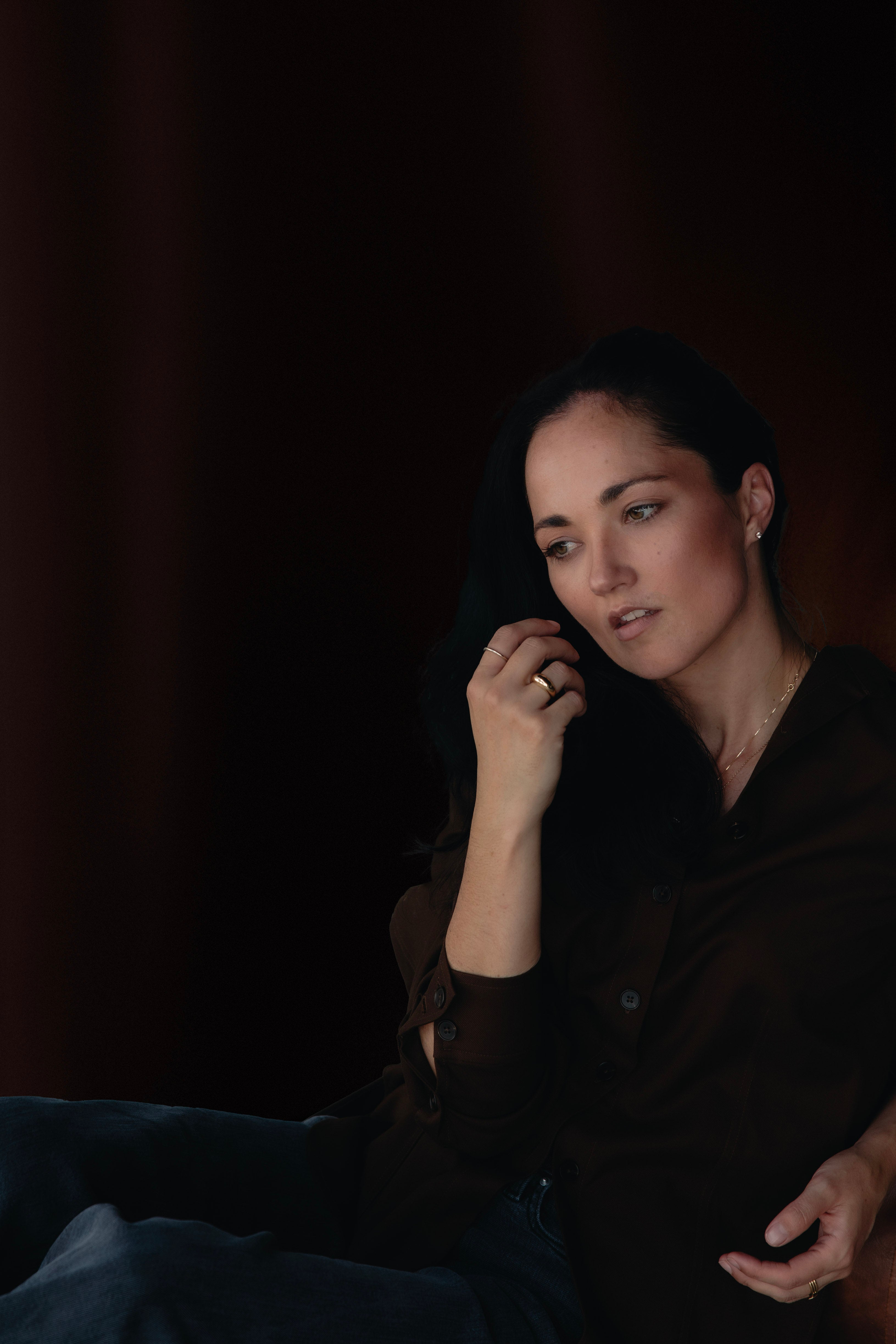 Stacked plain gold rings with a minimalist design, worn simply to highlight craftsmanship.