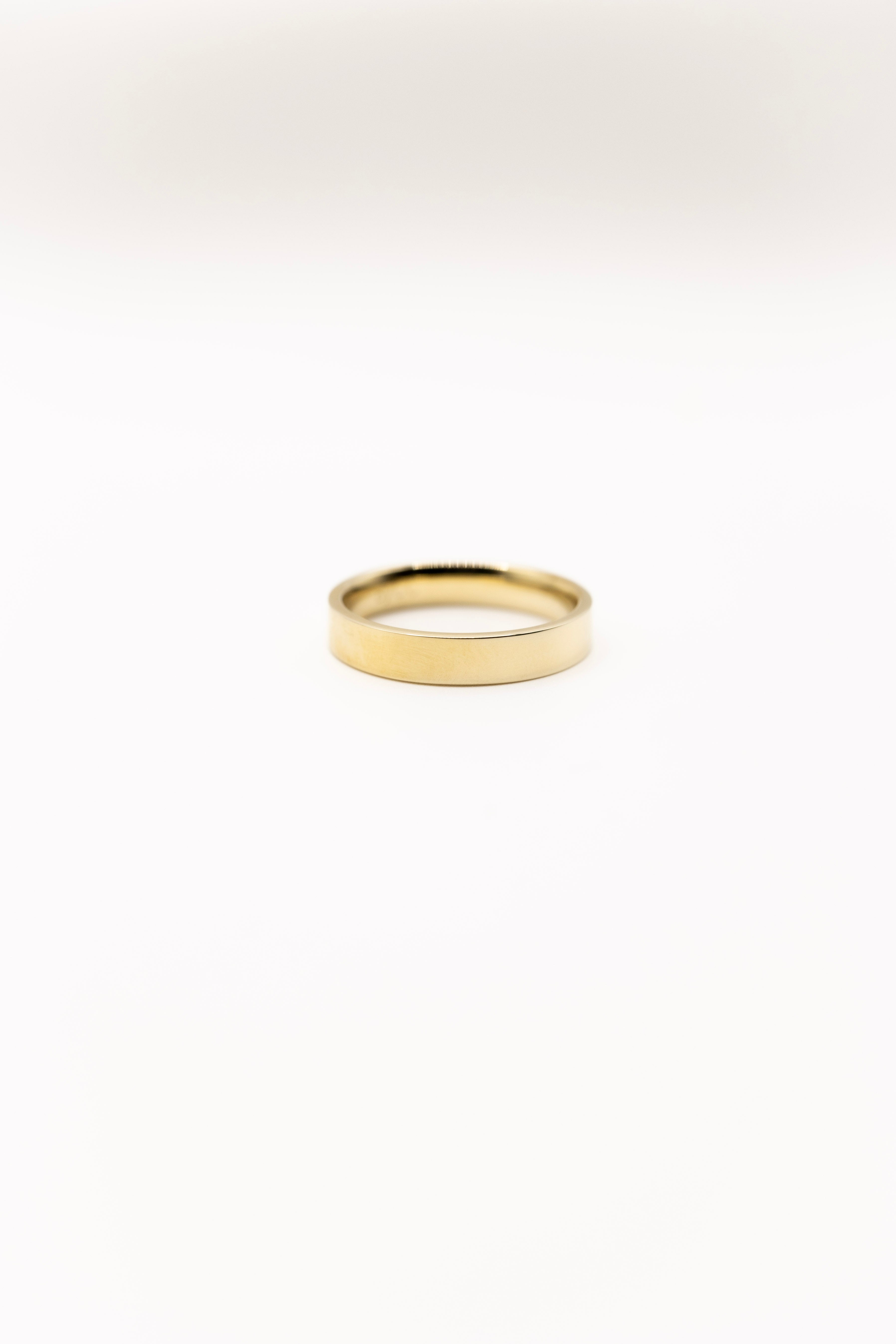 Gold ring on a white background