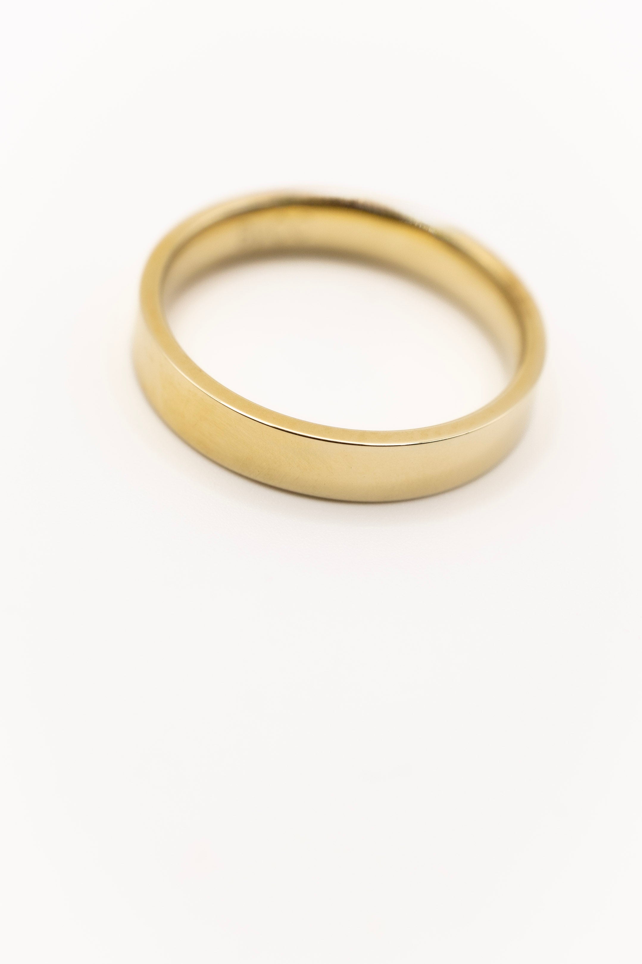 Australian made solid gold ring on a white background