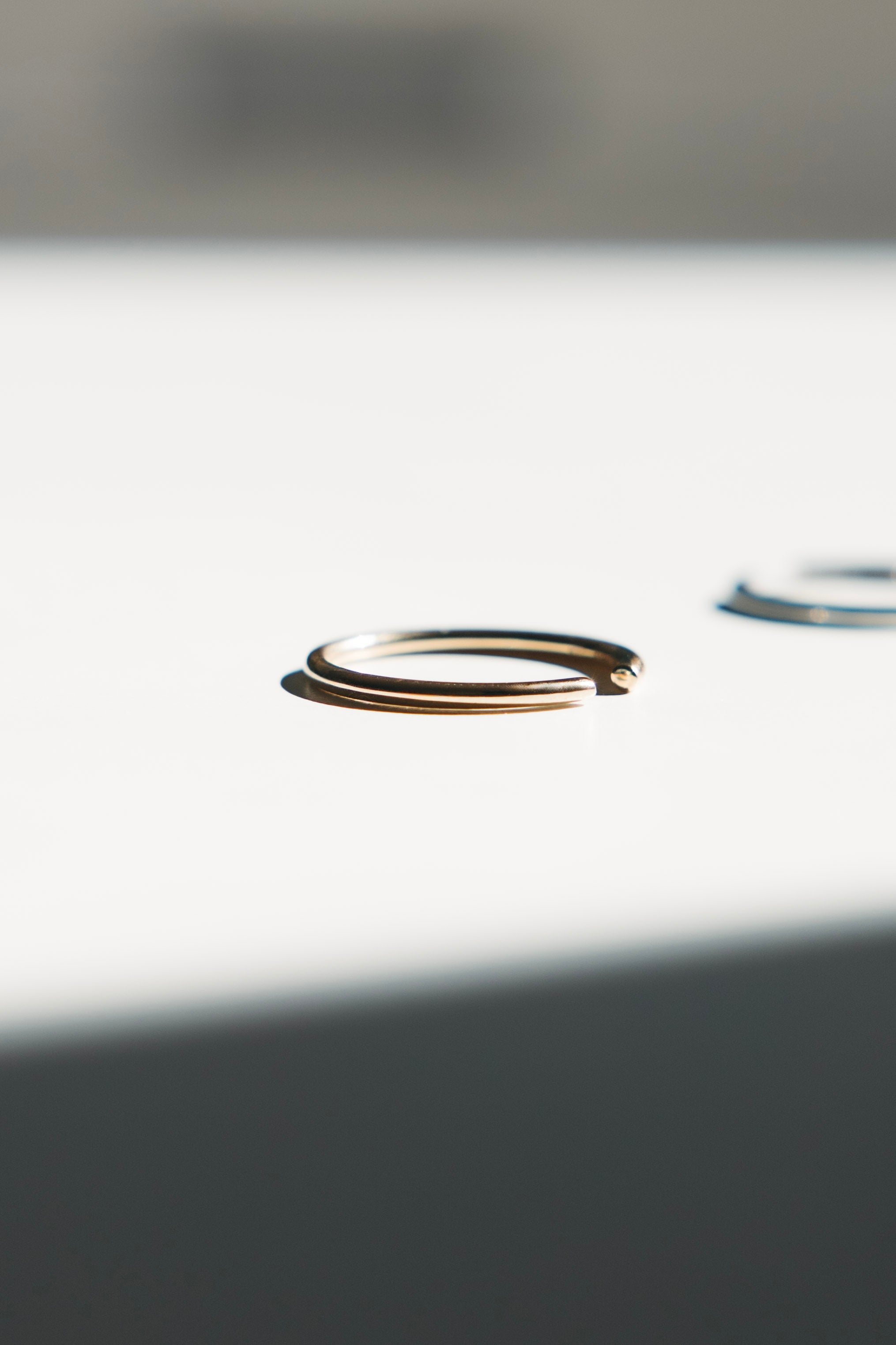 Plain solid gold bands arranged in a flat lay.