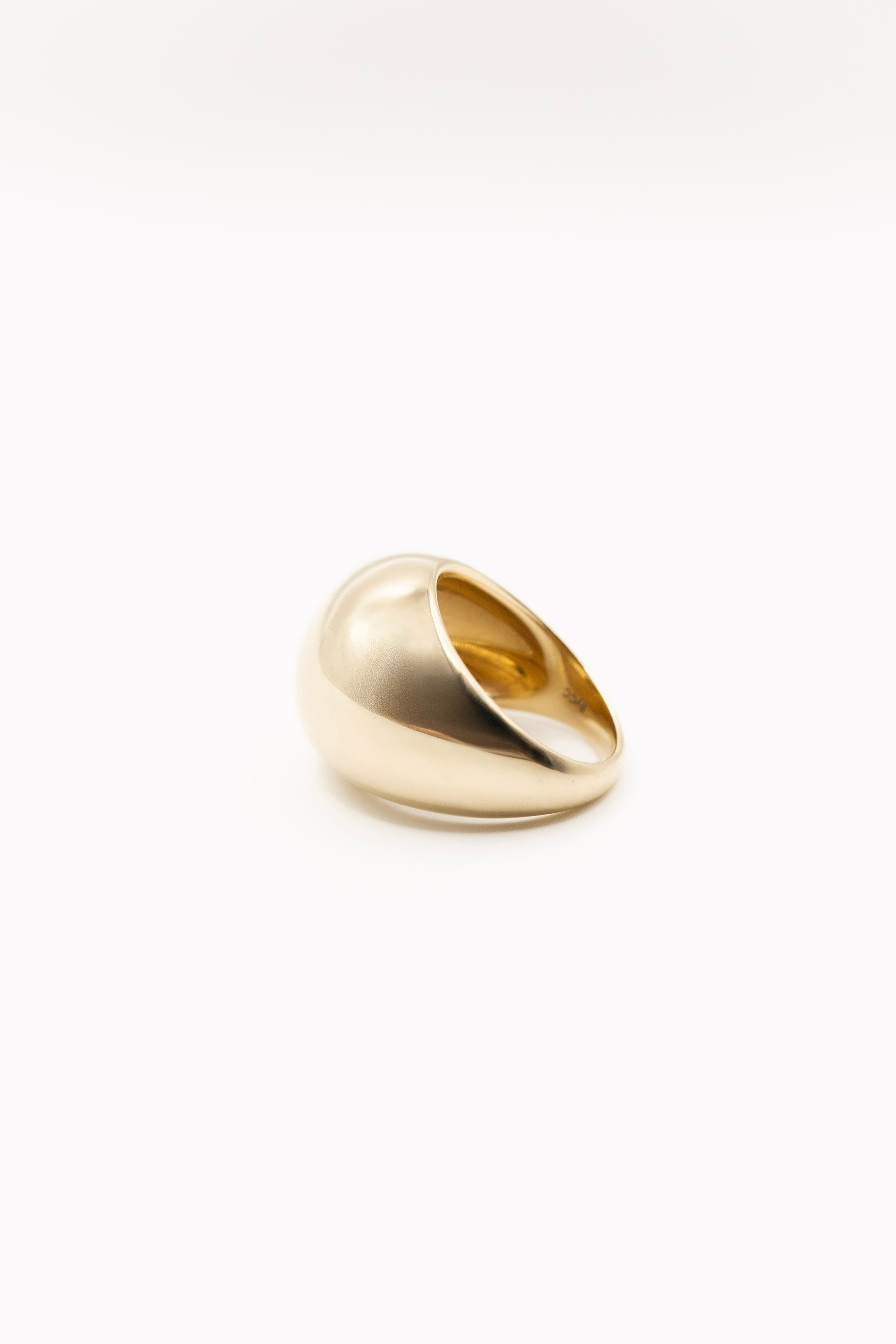 Gold ring on a white background